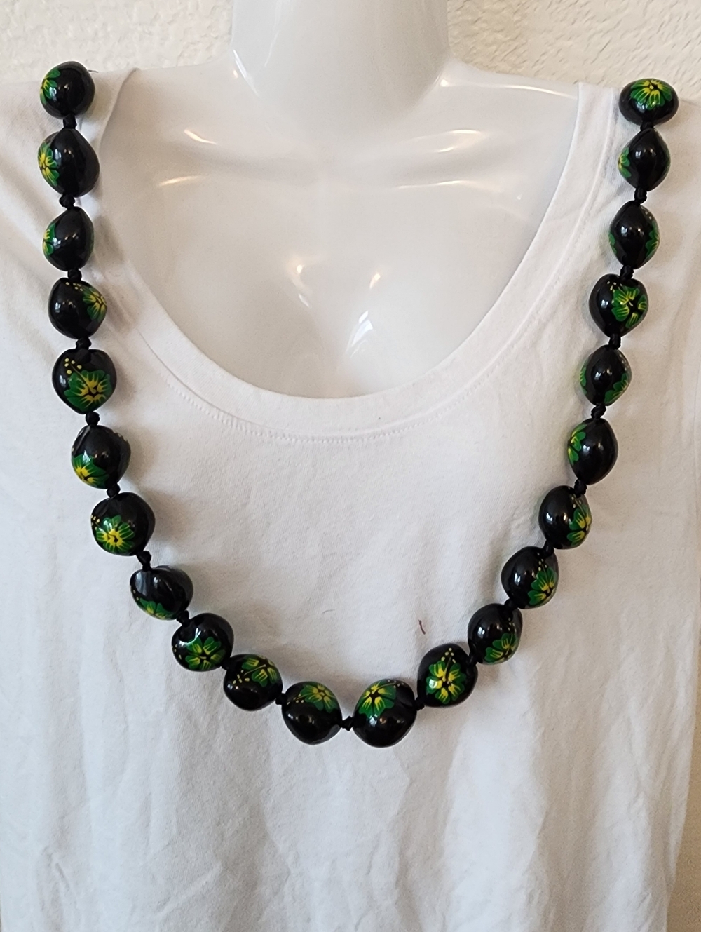 Hawaiian Kukui Nut Lei.  Hand-Painted Black and Green Floral Accents.